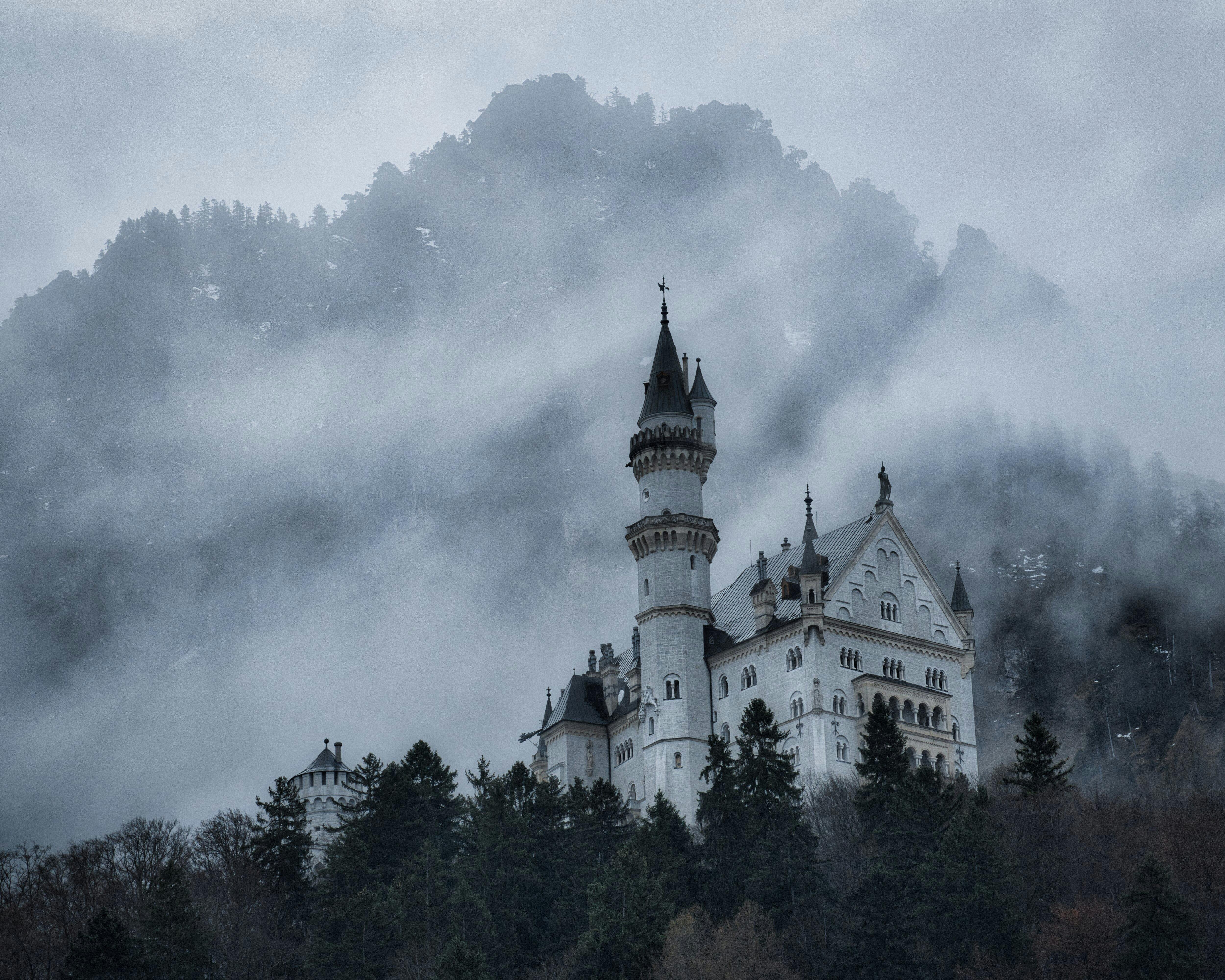A misty castle on a mountain, representing over-engineered solutions